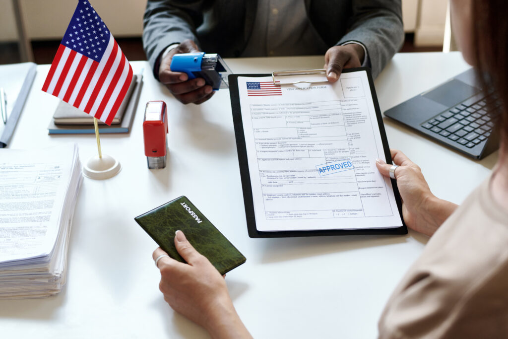 a woman getting her legal documents for US citizenship approved with help from rozas law firm