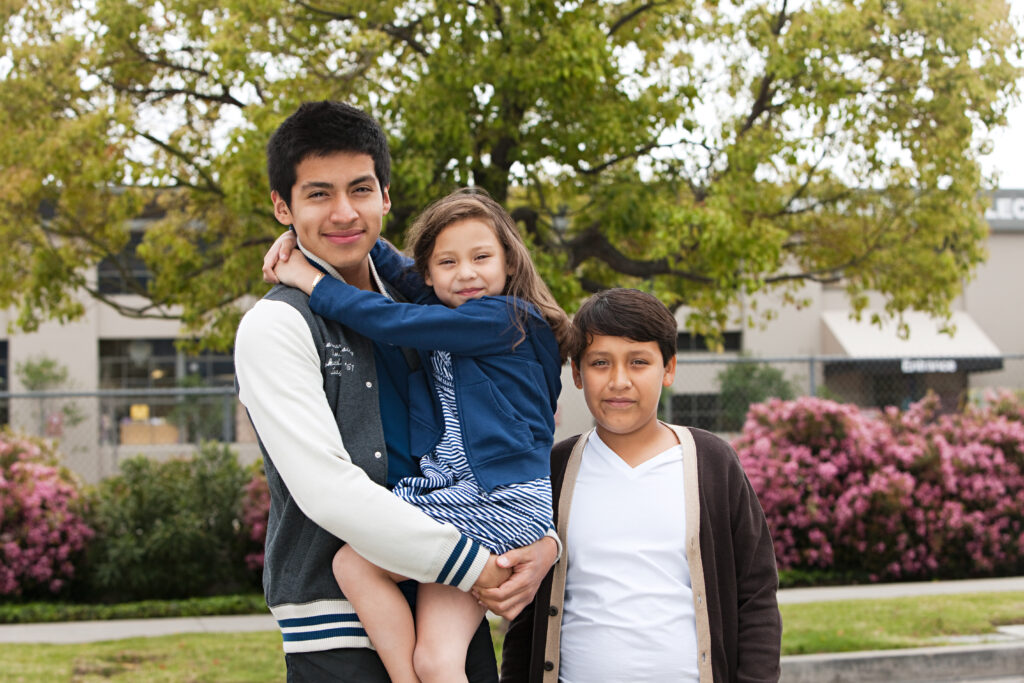 three siblings reunited after receiving help from a rozas sibling visa attorney