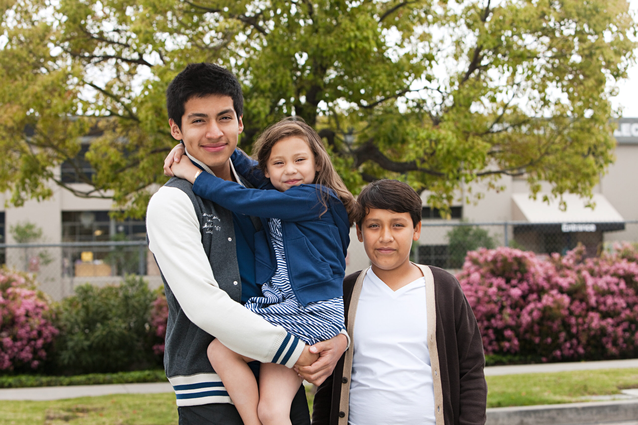 three siblings reunited after receiving help from a rozas sibling visa attorney