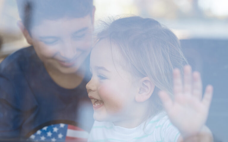 a child excited to enter the united states after her child visa was approved after help from a child visa attorney at rozas law firm