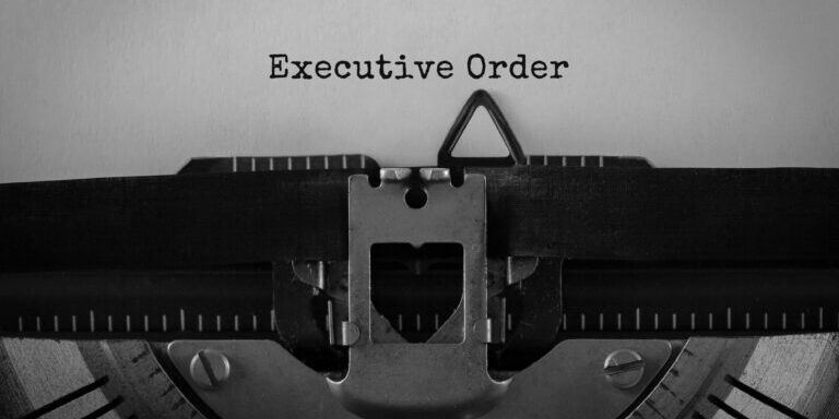 Text Executive Order typed on retro typewriter