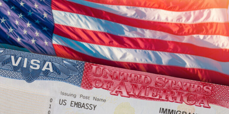 Immigration VISA United States of America. Green Card US Permanent resident for family. Work and Travel documents. US Immigrant. Embassy USA. Visa in passport. U.S.A. Government. U.S. American flag
