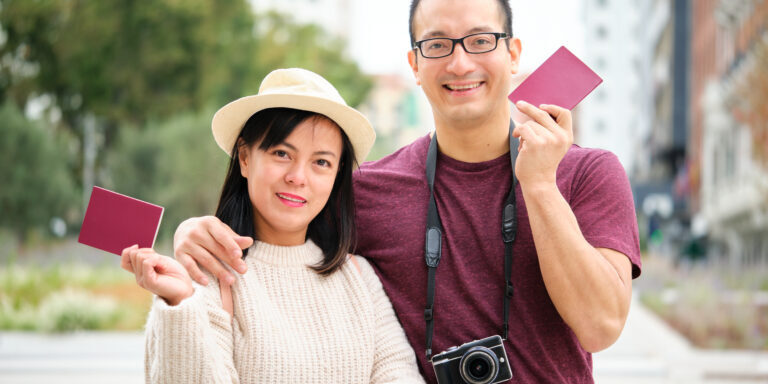 a couple holding their documents for k1 fiance visas in the united states