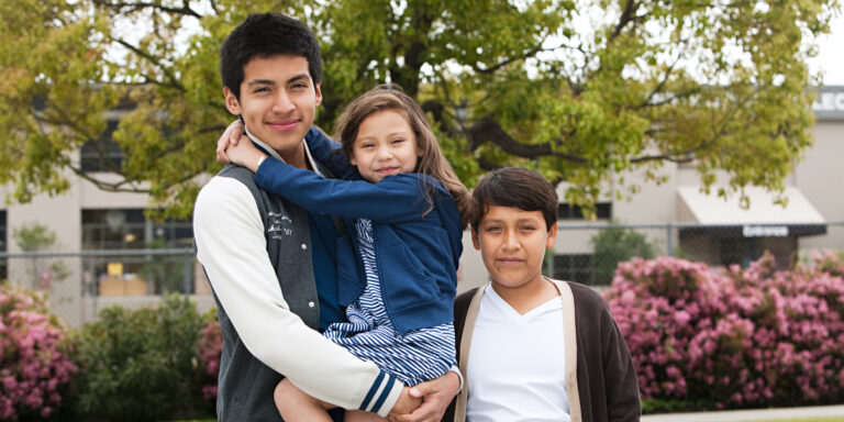 three siblings reunited after receiving help from a rozas sibling visa attorney